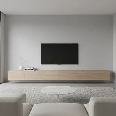 A minimalist living room with a natural wood floating TV stand and hidden storage, emphasizing clean lines.